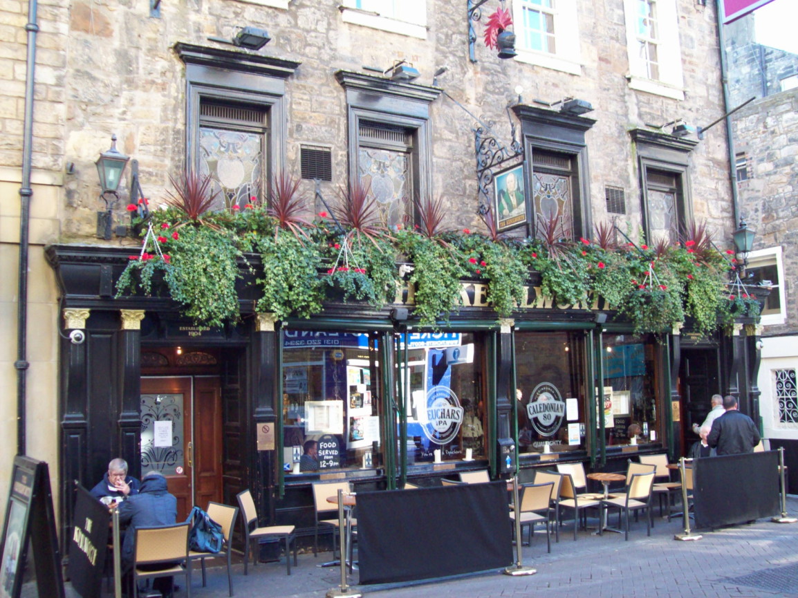 medium-sized Victorian pub forming part of a row of shops