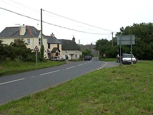 old-fashioned village houses facing green