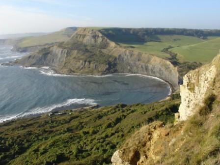 view across the top of a circular bay surrounded by dark cliffs