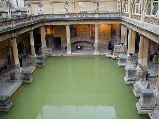 oblong tank of misty greenish water surrounded by a stone-pillared walkway