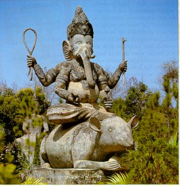 Statue of elephant-headed Hindu god Ganesh riding on a rat