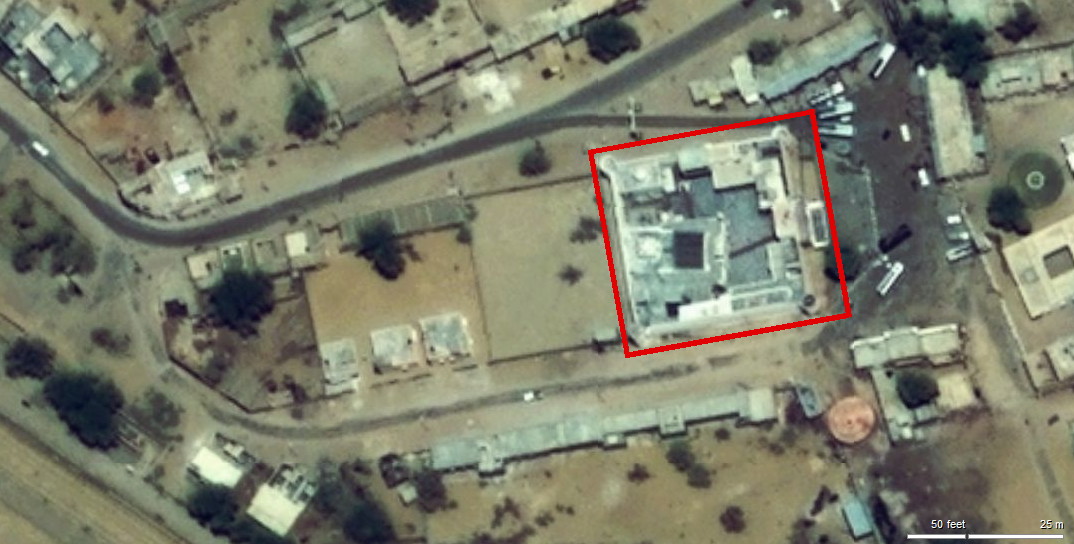 aerial photo\' of a square temple complex and the buildings around it