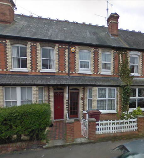 two-storey, red-brick Victorian houses with small front gardens, with bay windows on the ground floor, a second narrow layer of pitched roof between the ground floor and first (upper) floor which roofs the bays and creates sheltered porches, and cream brick trim around the windows and doors