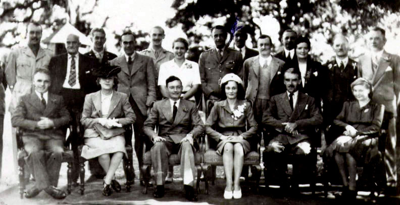 black and white photo\' of wedding guests seated in rows