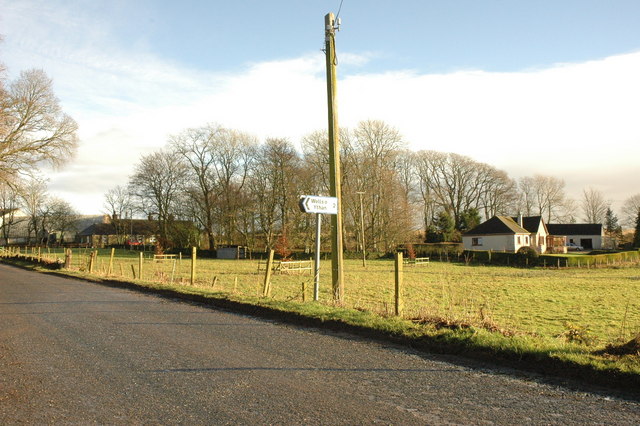 groups of small houses set back from a country road