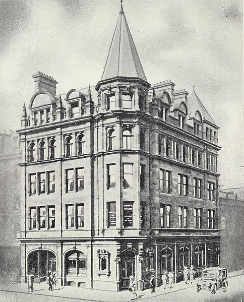 engraving of a tall Victorian Gothic building crowned with a spire, seen corner-on