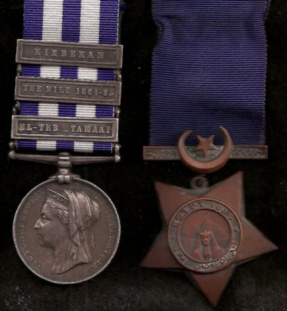 two medals: on the left a disc showing Queen Victoria\'s head and a ribbon striped vertically with three stripes of dark blue and two of white; on the right a bronze five-pointed star bearing a frontal view of the Great Sphinx and a plain dark blue ribbon