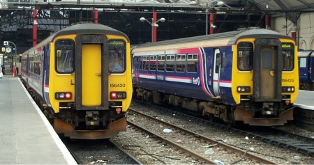 156420 and 156423 at Liverpool Lime St. 19.June.2004