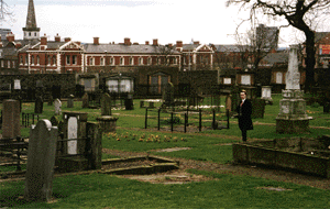 Graves with Poor House behind