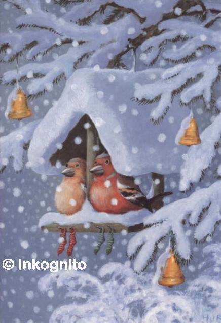 two chaffinches on a snow-covered bird-table, with their Christmas stockings hanging up