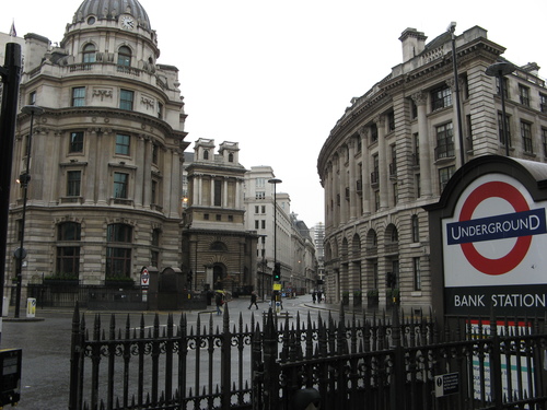 steps down to station surrounded by white buildings resembling wedding cakes