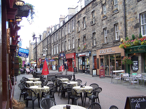 view of cobbled street with lots of tables and chairs