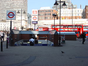 entrance to underground station surrounded by grand office blocks