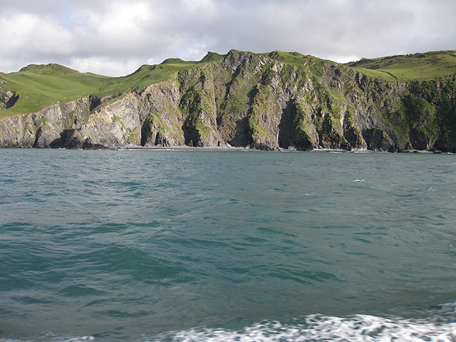 view of high, pleated dark cliffs