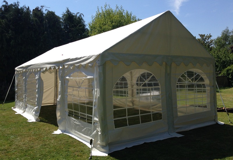 Photo of a large white tent with windows