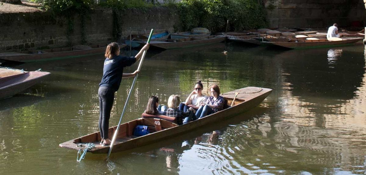Photo of a punt with a female driver and four passengers