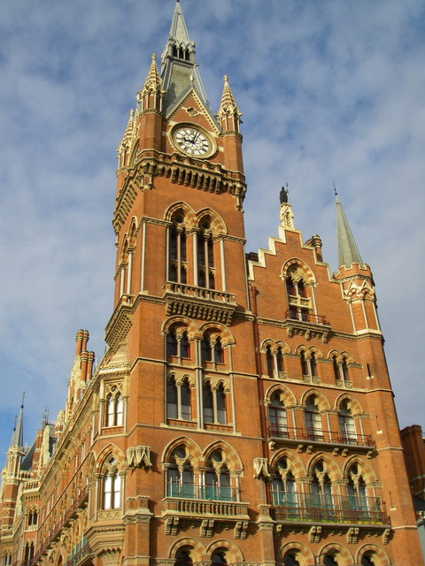 brown, Gothic-style Victorian building covered in spires