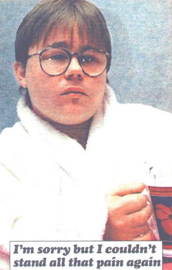 Newspaper photo' of Eric Cullen in white towelling dressing-gown, holding cup of tea