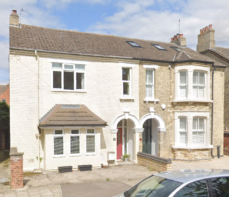 photograph of two medium-sized terraced houses