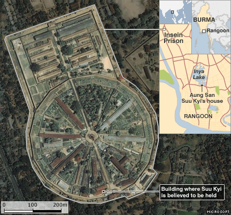 aerial view of prison in the form of a circle divided into eight segments, plus an oblong enclosure branching off it, all open to the air but dotted with buildings