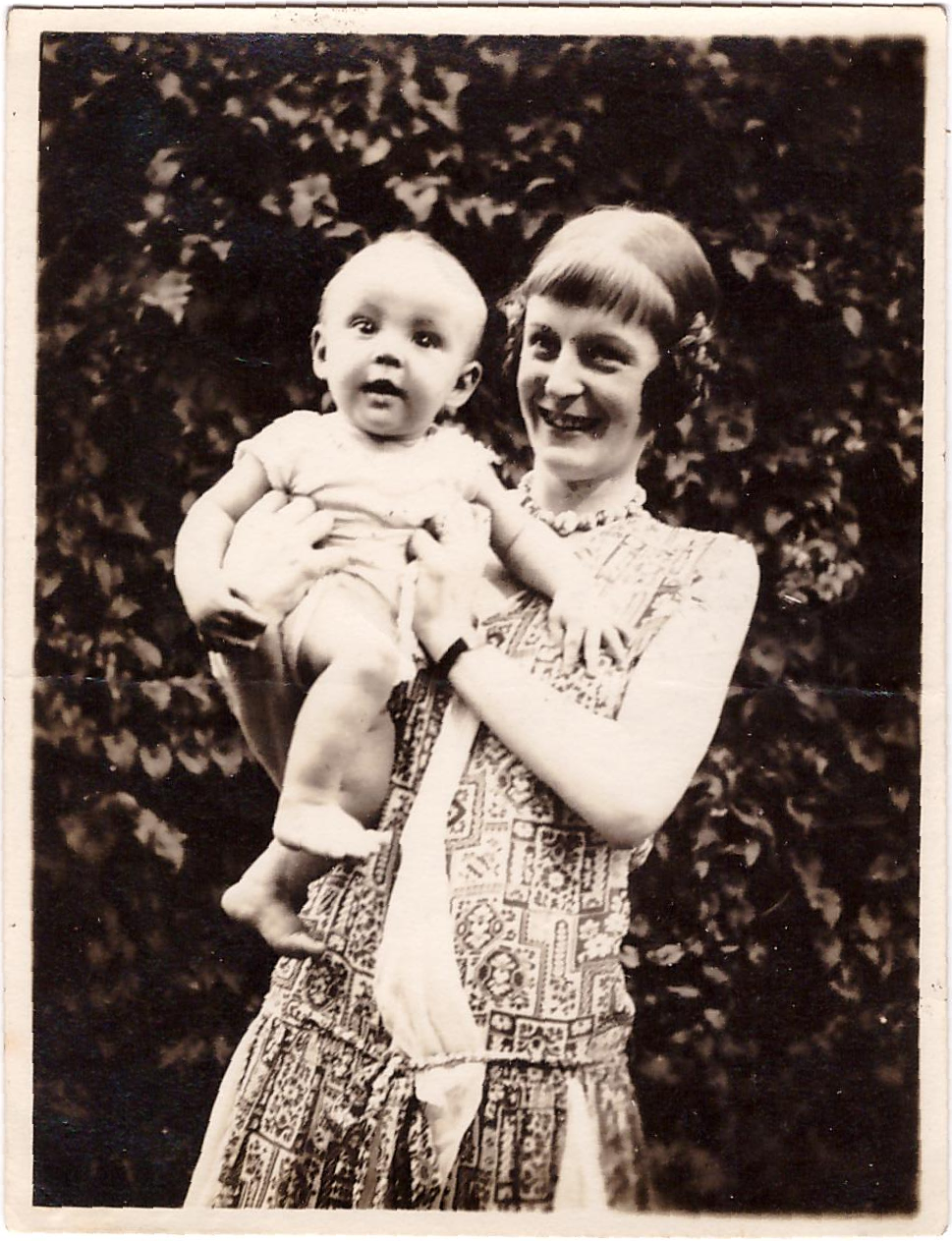 Ethel holds up baby Rory and both look at the camera