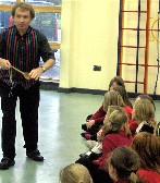 Abergavenny science entertainer Gerry demonstrating fun forces in a Newport school