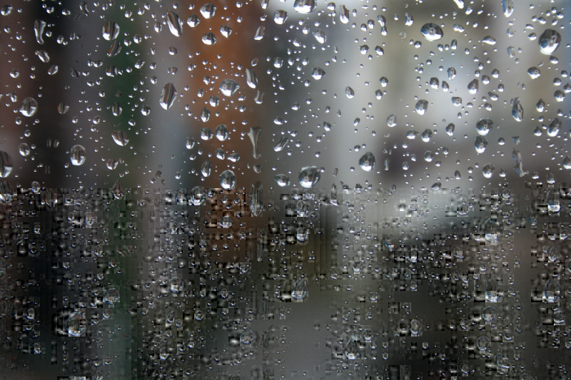 a photograph of a rain-dropped window