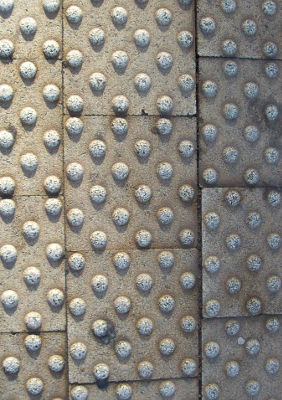 a photograph of some bobbly paving