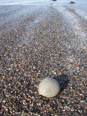 a photograph of a some pebbles on abeach